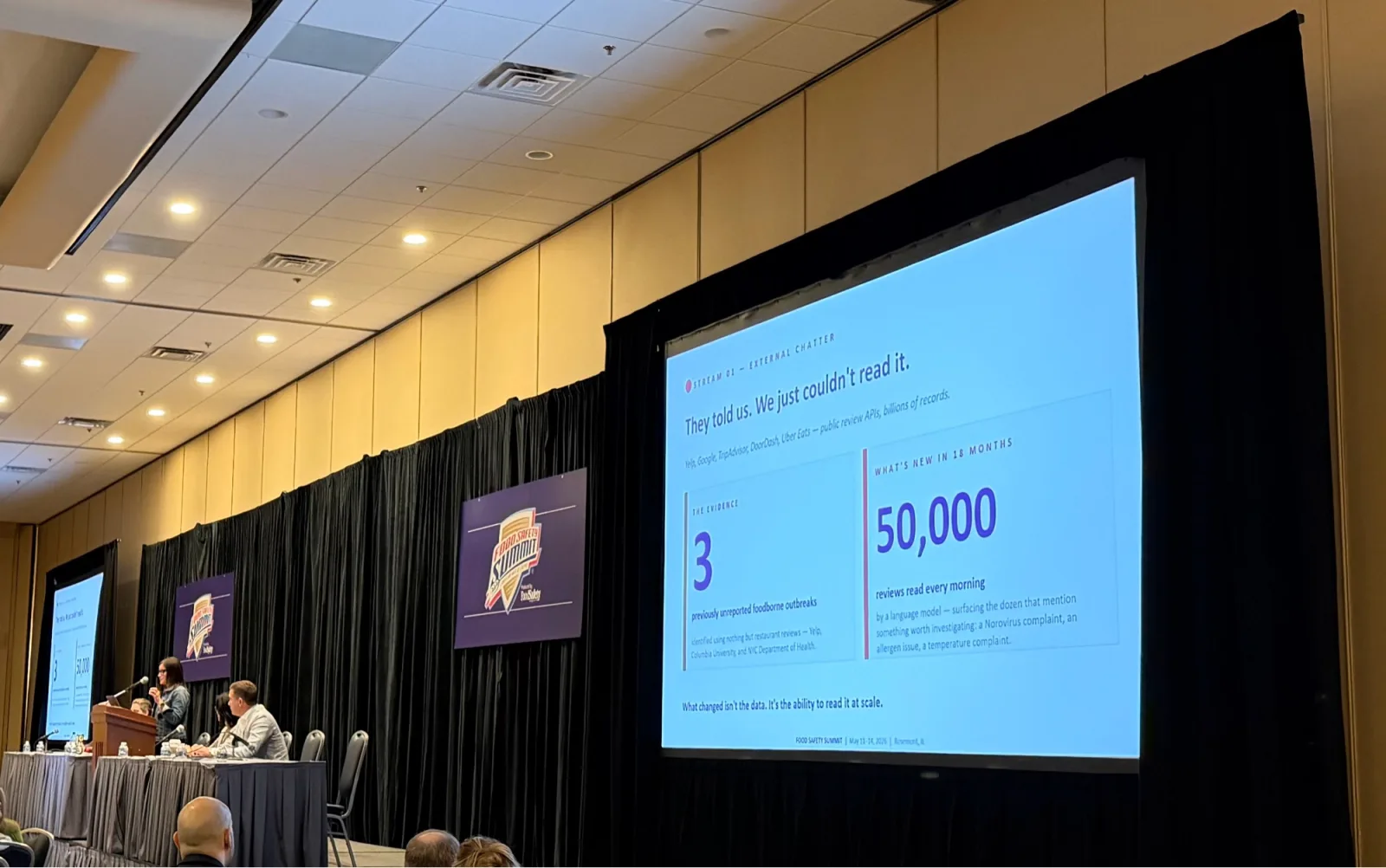 A slide from the opening AI workshop showing review-mining for outbreak detection.
